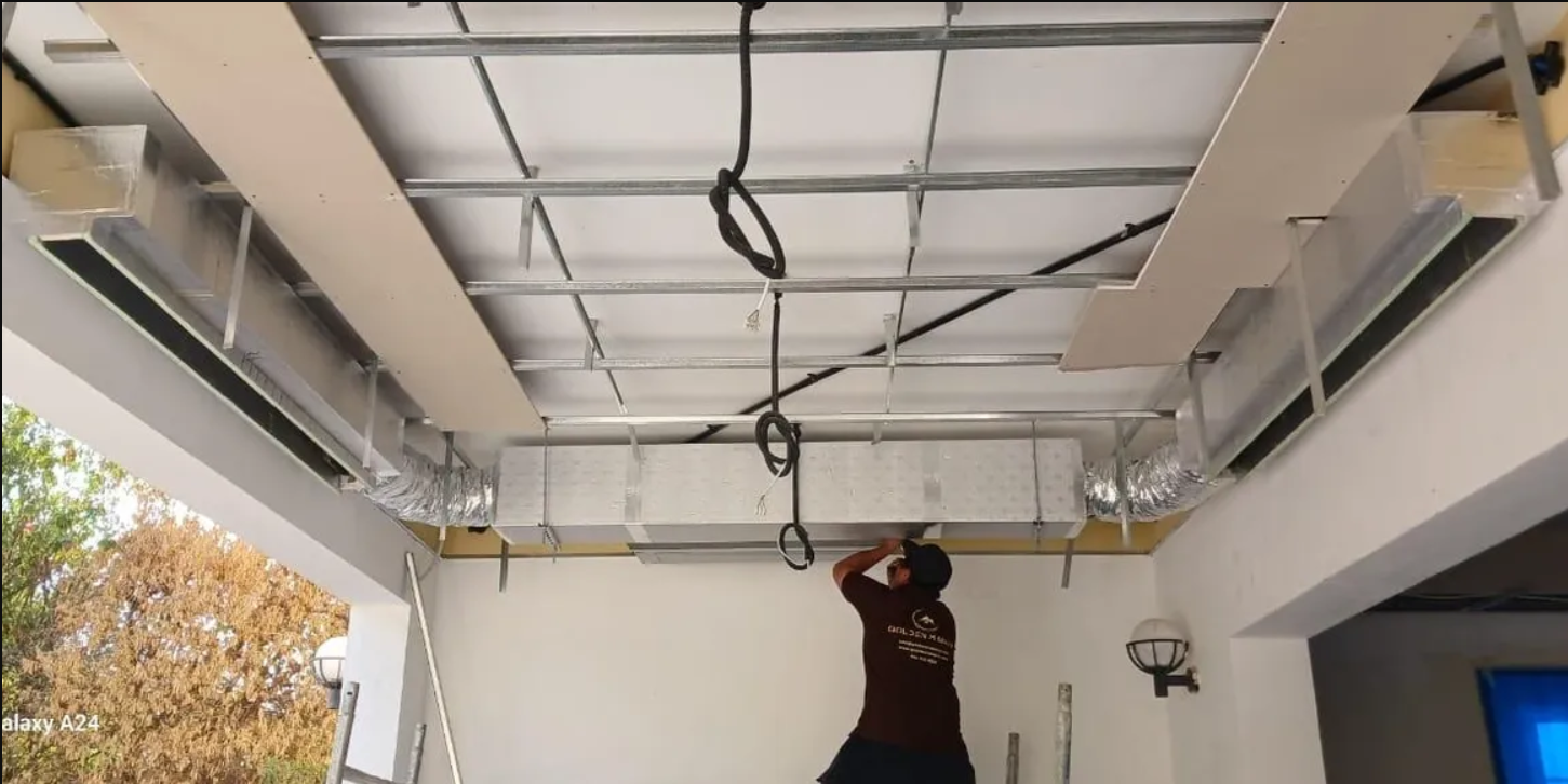 Tile mason laying floor tiles during a renovation